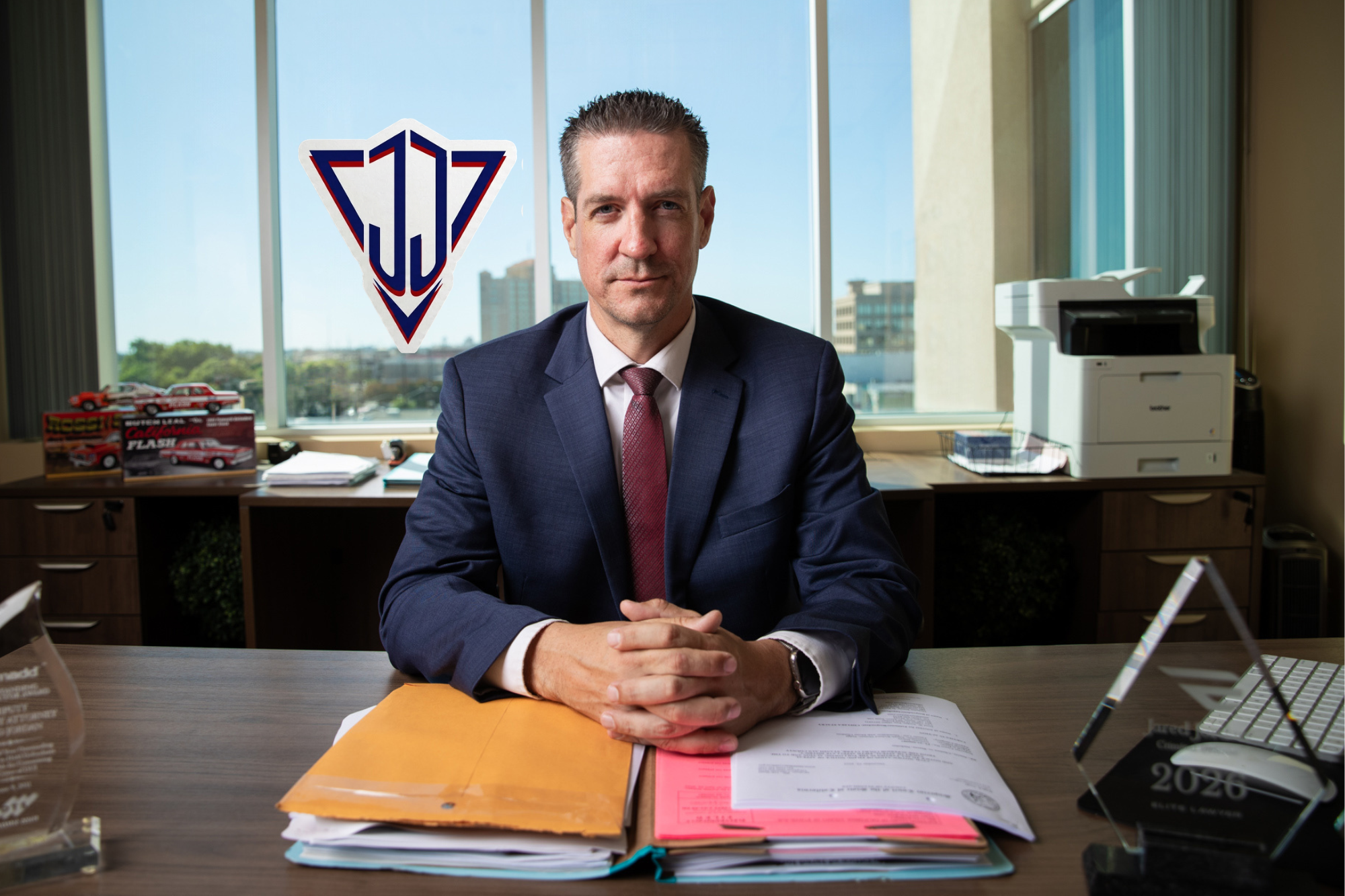 Jared Jordan, Modesto criminal defense attorney, at his office desk